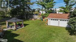Large Backyard with Raised Garden Beds, Garage/storage/hobby Building, Gazebo and Hot tub