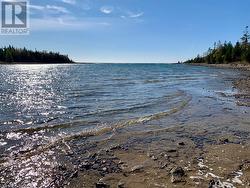 A gorgeous, protected inlet/bay with amazing west-facing open water Lake Huron views.