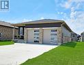 Double garage with concrete driveway