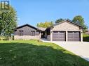 New stone, concrete driveway, windows, garage doors, board and batten