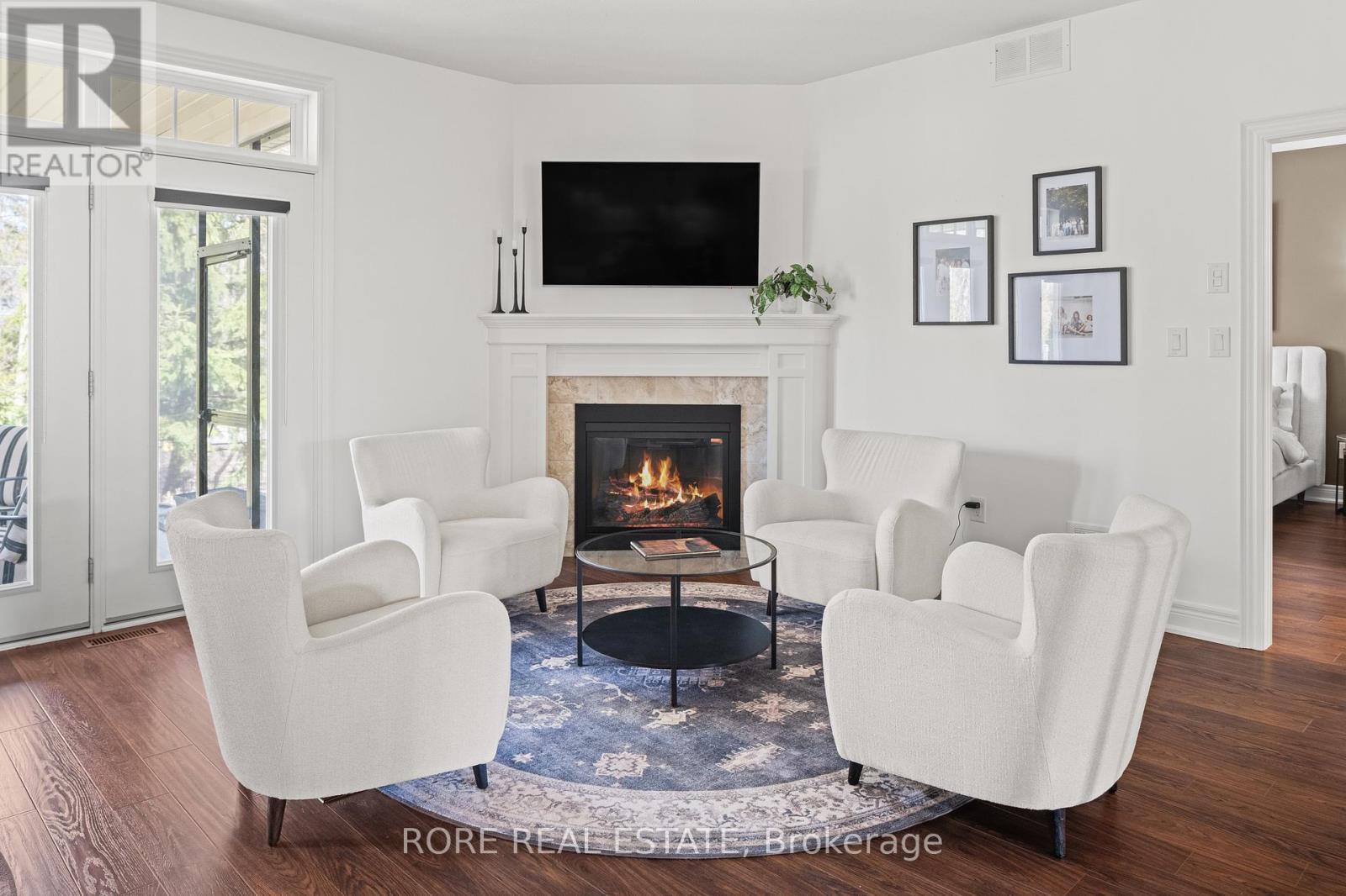 56 Sunrise Court, Fort Erie (Ridgeway), ON - Indoor Photo Showing Living Room With Fireplace
