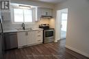 Kitchen with view into Dining Room/Sunroom