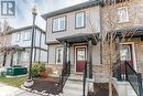Townhome / multi-family property featuring brick siding Townhome / multi-family property featuring brick siding