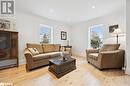 Living area with recessed lighting, baseboards, a wealth of natural light, and light wood finished floors Living area with recessed lighting, baseboards, a wealth of natural light, and light wood finished floors