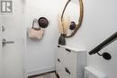 Welcoming entry w/built-in shoe closet & coat rack Welcoming entry w/built-in shoe closet & coat rack