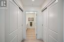 Primary bedroom's closets & entry to the ensuite.