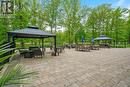 Outdoor patio area w/gazebos and tables.