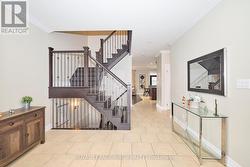 Foyer with wood staircase and ironrod spindles