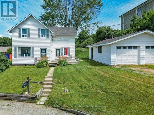 Front with double detached garage