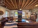 Great room with beams and exposed stone