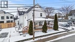 View of front of home with a wooden deck