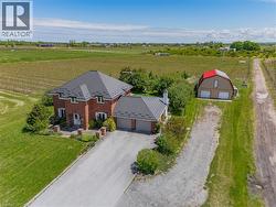 Aerial view of sparsely populated area with large plots for crops