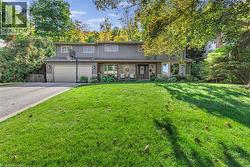 View of front facade featuring updated stone facing and vinyl siding