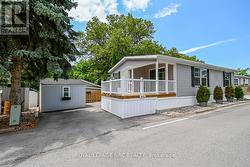 Adorable! The shed is included & one parking spot