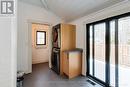 Mud room at back with laundry & tile floor