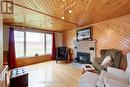 Main floor rec room with gas fireplace