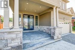 Covered, stamped concrete porch.