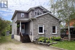 Front View - Stone and Vinyl Siding