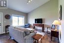 Main Floor Living Room With Vaulted Ceiling