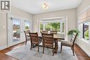 Dining area featuring a bay window, hardwood flooring, and direct access to an outdoor deck.