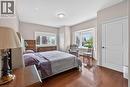 Bedroom featuring hardwood flooring, a bay window, double closets & 4pc. ensuite.