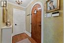 Front Entry. Solid custom door with speakeasy.
