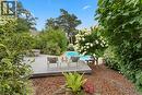 Large deck. Nikko blue hydrangeas. Extensive perennial plantings. Pink Weigela, Lime Light hydrangeas, ferns, honeysuckle, 2 large pines. Pine nugget pathway.