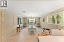 Currently used as a breakfast room and office. Originally a family room. Heated floors. Plantation shutters. California knock-back ceiling. Adjoins kitchen.