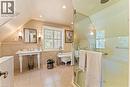 Large walk-in shower with rainshower head, heated floors