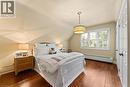 Southwest bedroom. 2 double closets and one hidden closet. California shutters, handscraped, dark hardwoods