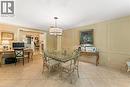 Currently used as an informal dining area and office. Heated flooring. High end fixture. Plantation shutters. Adjoins kitchen and mudroom.