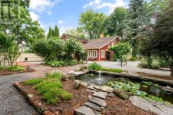 Fenced garden with fish pond