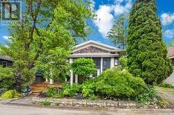Private front porch with mature plantings.