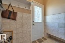 Entryway featuring ceramic tile flooring and wainscoting