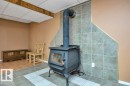 Freestanding wood-burning stove with a tiled backdrop