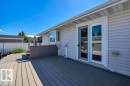 Spacious multi-level composite deck with a privacy screen