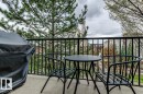Outdoor balcony featuring a concrete surface and black metal railing
