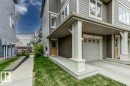 Gray siding exterior featuring white trim accents