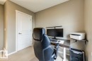 Neutral wall paint, white trim, and white two-panel interior door