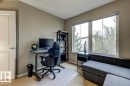 Interior room featuring light beige wall paint and carpeted flooring