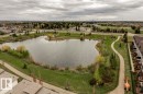 Expansive artificial lake surrounded by green space and walking paths