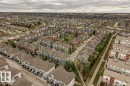 Expansive residential community featuring a variety of housing types, including single-detached homes, townhomes, and multi-story buildings