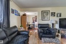 Expansive room featuring wood-finish flooring and neutral wall tones