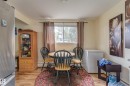 Open-concept dining area featuring wood-finish flooring