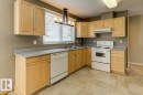Kitchen featuring light wood-finish cabinetry and light countertops