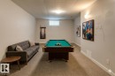 Recreation area featuring a billiard table, recessed window, and light-toned carpet flooring
