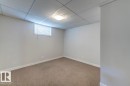 Neutral-toned carpeting paired with light gray walls and white trim
