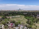 Aerial perspective showcasing a residential neighborhood with a distant city skyline
