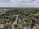 Aerial perspective showcasing a residential area with mature trees and established streets