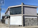 View of property exterior featuring a garage, stone siding, and stucco siding View of property exterior featuring a garage, stone siding, and stucco siding
